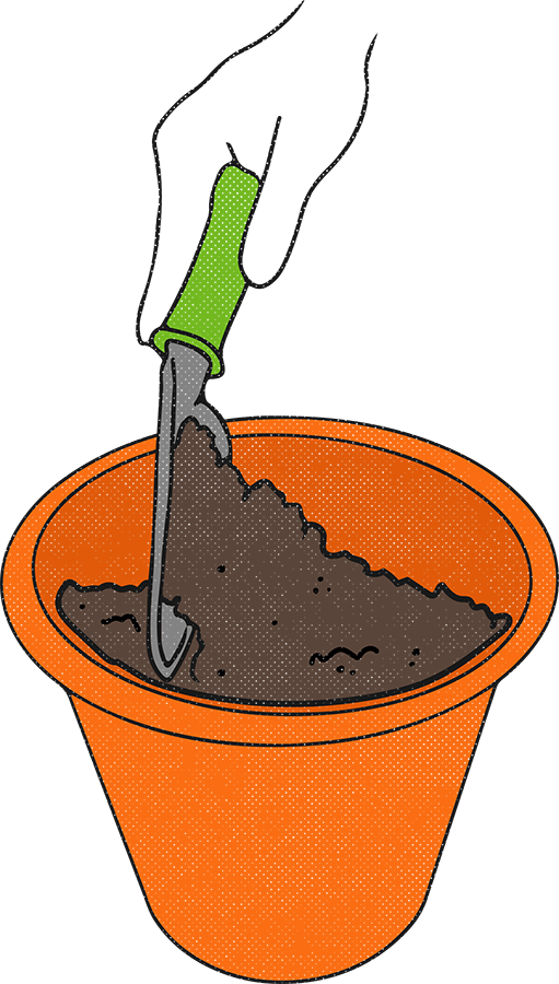 hand filling a pot with soil